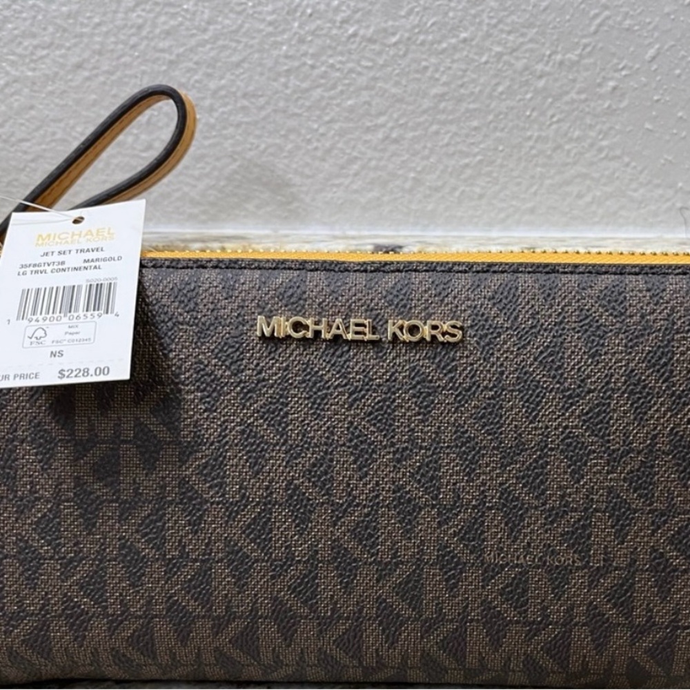 Michael Kors Dark Brown Monogram Clutch - New never used. Smoke & pet free home